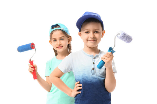 Little children with paint rollers on white background