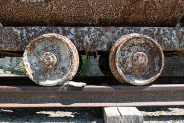 Mine wagon rusty wheels close-up