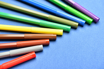 Fototapeta premium Colorful markers on color background