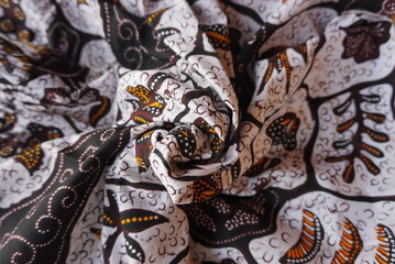 A traditional Indonesian fabric, namely batik cloth which has unique and different patterns and image motifs for each region and is rolled up to form flowers. Cultural theme photos, typical of Asia