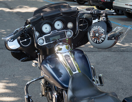 Dashboard Close-up Of A Harley Davidson Motorcycle And The Rider's Helmet