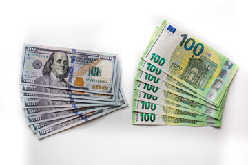 Exchange of dollars for Euros, trade between the EU and the USAOne hundred usd banknotes money and Euro, top view. Closeup view, finance theme