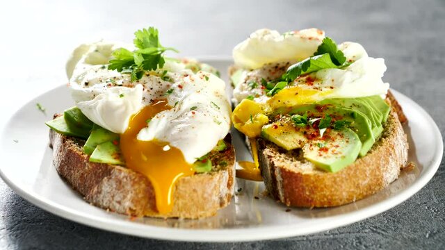bread toast with avocado and poached egg