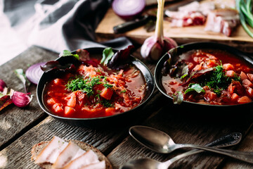 Ukrainian red borscht in a black plate