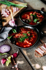 Ukrainian red borscht in a black plate