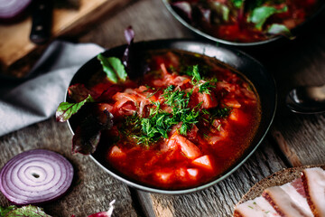 Ukrainian red borscht in a black plate