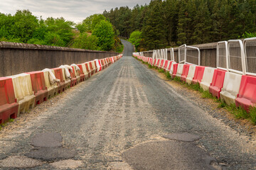 Road over the Washburn dam, leading over the Thruscross Reservoir near Bolton Abbey, North Yorkshire, England, UK