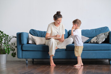 mom and son spend time together at home.