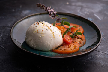 Buffalo mozzarella with tomato and basil