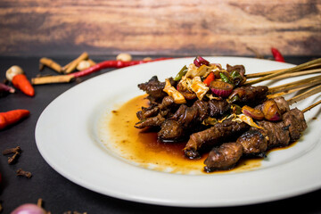 Satay is a food made from meat that is cut into small pieces and skewered