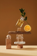 Mockup geometric shape stone podium with glass perfume bottle. Stone, wood shape with lemon yellow ingredients shades over concept background. direct angle . Can use as perfume and cosmetics mock up