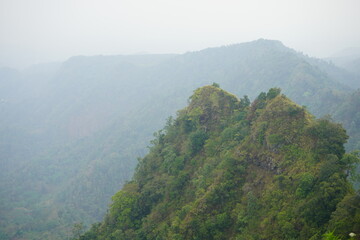 Naklejka premium Mount Muria is a stratovolcano-type mountain with a height of 1602 meters located in 3 districts namely Kudus, Jepara, Pati in the province of Central Java, Indonesia.