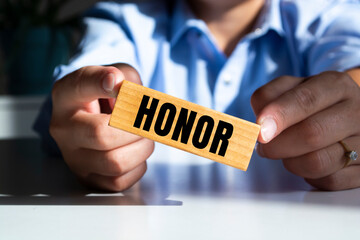 Man made word, text Honor with wood blocks. Concept.