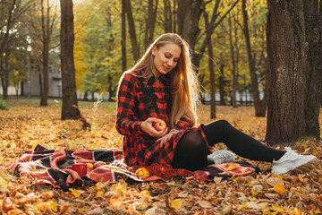 Fall picnic ideas, autumn day off, solo picnic, Self Date, Things to Do by Yourself. Alone young woman enjoying life in the autumn park