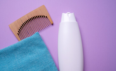 bottle of shampoo or hair conditioner, on a pink background