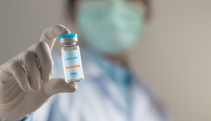 Fototapeta premium Doctor or scientist holding liquid vaccines booster. fight against virus covid-19 coronavirus, Vaccination and immunization. diseases,medical care,science, vaccine booster concept.