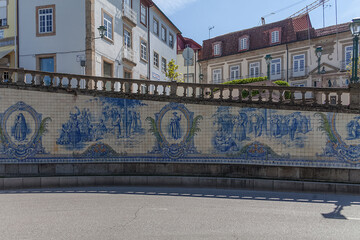 General view of the iconic tile panel, designed and painted by Joaquim Lopes in 1931, represents regional costumes and scenes of traditional life - obrazy, fototapety, plakaty