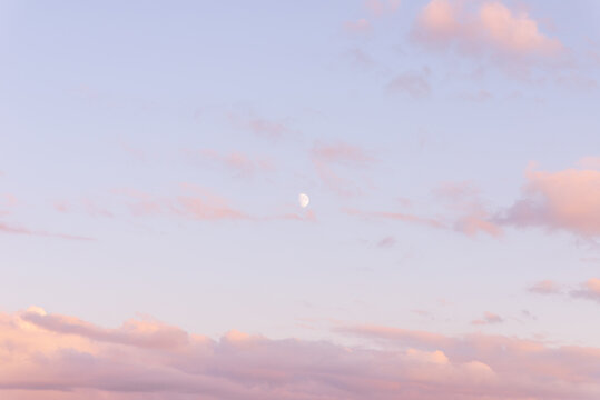 Purple and Pink Sky,moon and beautiful clouds with colored background.