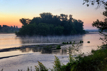 Sunrise on the Loire river bank in the Gaston island. Chatillon-sur-Loire village