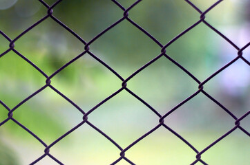 Fototapeta premium Photo of steel wire mesh fence