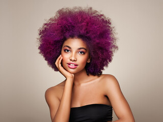 Beauty portrait of African American girl with colorful dyed afro hair. Beautiful black woman. Cosmetics, makeup and fashion - obrazy, fototapety, plakaty