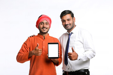 Indian Farmer showing tablet with bank officer or corporate government employee on white background.