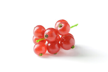 Berries of ripe tasty red currant isolated on white background. red currant with a leaf. a slide of red currants. Red currant berries with leaf isolated on white background.