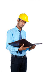Young Indian male engineer wearing yellow color hard hat on white background.