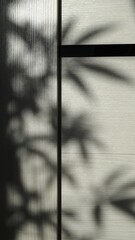 shadows from a plant on a light wooden surface with dark stripes as an original backdrop, a play of light and shadow in a summer airy background with a silhouette of a plant on the interior surface
