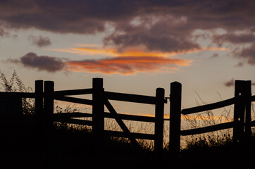 sunset over the fence