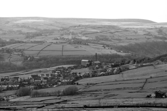 monochrome scenic view of the village of old town in calderdale west yorkshire with surrounding pennine farms and hills