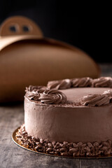 Piece of chocolate truffle cake on wooden table