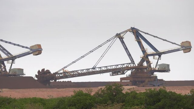 an iron ore stacker loader in operation at port hedland in western australia