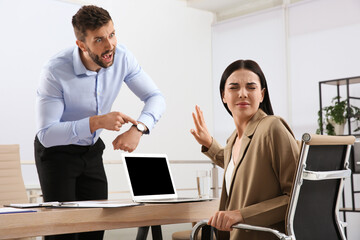 Boss screaming at employee in office. Toxic work environment