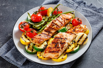 grilled salmon and vegetables on a plate