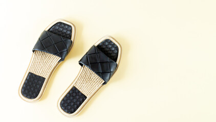 Pair of woman black beach sandals or slippers top view