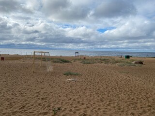 empty and abandoned sandy beach in the daytime.