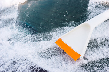 Scraper for cleaning ice from car windows