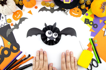 Instructions for making a craft with children from paper bat.