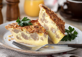 Two slices of sausage quiche