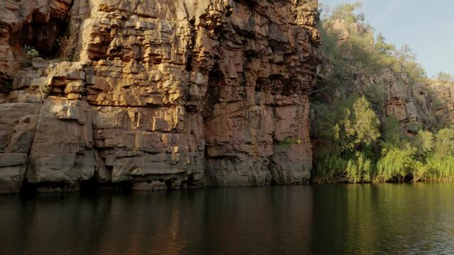 view during sunrise cruise of nitmiluk gorge, also known as katherine gorge at nitmiluk national park in the northern territory while facing downstream