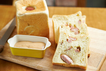 Sausage bread and sauce on a cutting board