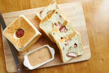 Sausage bread and sauce on a cutting board