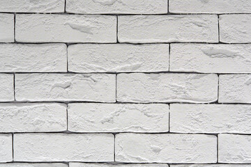 Photo of a white brick wall. Abstract background