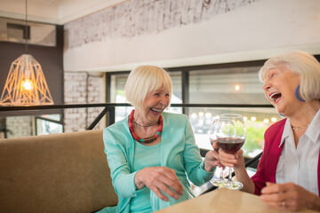 Senior cheerful friends spending time together and feeling amazing