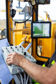 Close-up of male hand operating machine