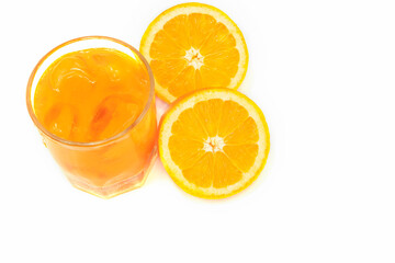 orange fruit and glass on white background