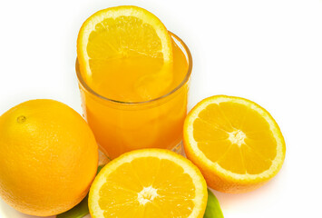 orange fruit and glass on white background