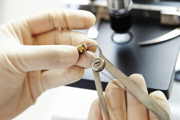 Doctor hand measuring tooth model