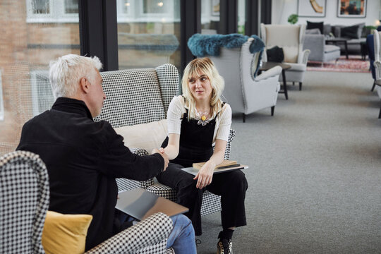 Coworkers shaking hands